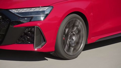 The new Audi RS 3 Sedan in Progressive red Driving Video