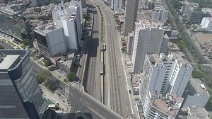 Miraflores district, in Lima Peru. During the lockdown for coronavirus. Empty streets, few public transportation. Aerial view. Some cars and buses in one of the more transit avenues in Lima.