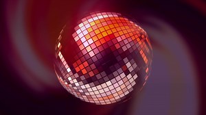 Disco ball in abstraction. Motion. A disco ball that shimmers with different colors and spins on a simple black background.