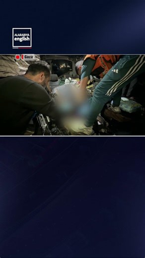 Palestinians Inspect Charred Vehicle Following Israeli Strike