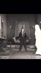 Buster Keaton directing traffic in “The Haunted House” two reel silent comedy 1921. The film was written and directed by Edward Cline and Buster Keaton. Produced by Metro Pictures, Hollywood California. The film featured Buster Keaton, Virginia Fox, Joe Roberts, and Edward Cline. | ArtDeco.Joe