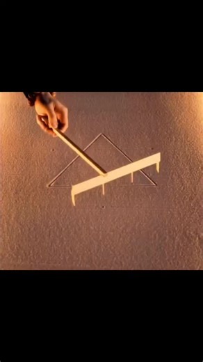 axisrnx18M on Instagram: "This video uses a mesmerizing sand animation to illustrate the fundamental role of geometry in architecture, beginning with a simple triangle drawn with a rake that serves as the blueprint for a much more complex structure. As the artist continues to layer intersecting lines and nested shapes, the sand art evolves from a flat diagram into a sophisticated, symmetrical pattern that mimics the skeletal frameworks and floor plans of grand buildings. This continuous, rhythmi