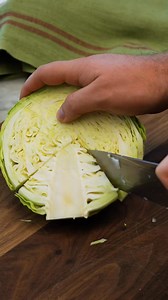 Cabbage caramelizes in the oven before getting topped with a zesty, cheesy dressing reminiscent of Caesar, creating a profoundly gratifying side that complements roasted chicken, pork, or steak beautifully. Ingredients - 1 small head green cabbage, chopped into 1-inch pieces (about 8 cups) - 4 tablespoons extra-virgin olive oil, divided - 1/4 teaspoon salt - 2 tablespoons grated Parmesan cheese - 2 tablespoons rice vinegar - 1 1/2 teaspoons reduced-sodium soy sauce - 1 teaspoon Dijon mustard - 1