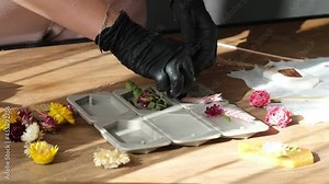 businesswoman creates a flavored wax tablet at home. creative profession. how to start making money on a hobby concept.