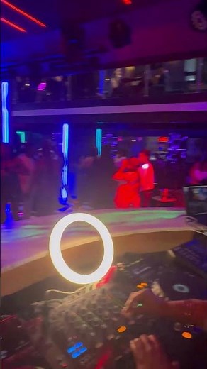 Vibrant Nightlife with DJ and Dance Floor Vibes