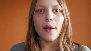 Upset and unhappy teen girl talking to a camera with anger. 4K UHD