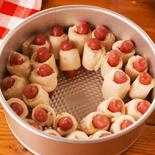 Pull-Apart Pigs In A Blanket use the most GENIUS cake pan hack. Full recipe: http://dlsh.it/CLWlQH1 | Delish