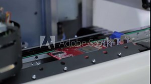 Close up view: automated visual optical inspection system for quality control of printed circuit board. Industrial, robotic, measurement, production, technology and manufacturing concept