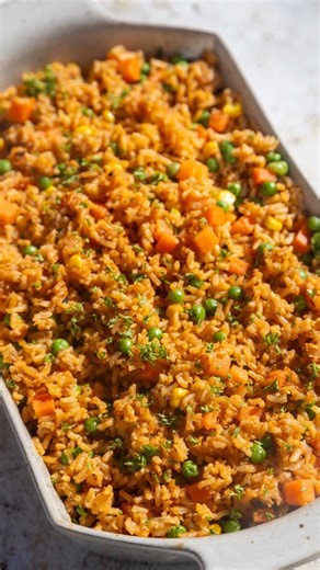 A fluffy arroz rojo recipe (Mexican red rice), made with ripe tomatoes, a touch of spices, and a blend of optional veggies. The whole thing comes together in less than 30 minutes which is mostly cook time! 🌟 comment “recipe” and I’ll send the recipe straight to your DMs! :) Or get the full recipe through the link in my bio on my profile page - or at this address - https://becomingyouwithjulie.com/mexican-red-rice-arroz-rojo/ #arrozrojo #mexicanrice #redrice #recipe #plantbased #veganfood #mexic