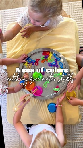 Real talk: my kid will ignore an expensive toy but suddenly pipe cleaners = the greatest catch of the day. 🐟 All I did: \t•\tTwist pipe cleaners into fish shapes (doesn’t need to be Pinterest perfect). \t•\tToss them on a tray with some muffin tins. \t•\tAdd tongs for “fishing” and sorting. Boom. We had a whole fishing game in minutes. And the bonus? Fine motor practice, color sorting, pretend play, focus skills… all hiding behind the chaos of fishing on the living room floor. Sometimes the sim