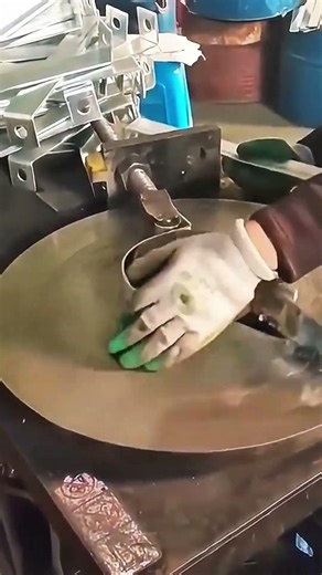 bending metal strips into circular shapes using manual press machine in industrial workshop facility