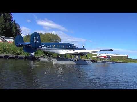 Pacific Seaplanes Beech 18 on floats photo call by row boat