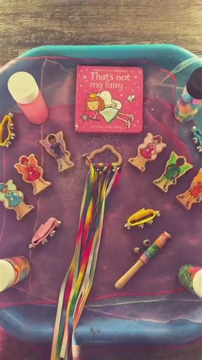 Baby Room Fairy Sensory Play – “That’s Not My Fairy” 🧚✨ Our babies explored a fairy-themed sensory tray inspired by the story That’s Not My Fairy. With soft fabrics, colourful ribbons, sparkles and musical resources, the babies were able to explore different textures, sounds and movements while enjoying story time together. Sensory activities help support curiosity, early language development and exploration, while introducing babies to books in a fun and engaging way. #babyroom #babysensory #s