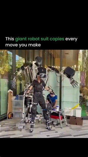 Artificial intelligence | Robotics on Instagram: "This 9 foot exoskeleton from a Japanese company mirrors your every move in real time. No motors. No hydraulics. Just pure mechanical linkages that turn your motion into giant amplified movements. It looks unreal, but it feels natural, almost like your body just got upgraded. People use it for shows, events, and live demos, and the reactions are wild. It really gives you that sci fi moment where you feel like you’re piloting a full size robot. Wha