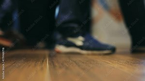 closeup side view walking shoes public space moving crowd people movement foot going everywhere leathers shoe walk move human urban inside city place wooden floor legs elegant steps stepping step walk
