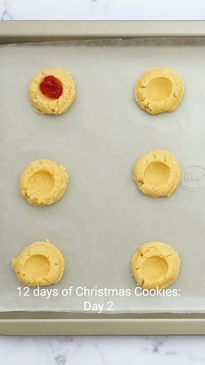 Day 2 of the 12 days of Christmas Cookies! These Shortbread Jam Thumbprint Cookies have a tender, buttery base and a bit of jam in the center. An easy cookie recipe that tastes delicious! Ingredients ▢1 large egg yolk ▢1 tablespoon heavy cream ▢1 teaspoon vanilla extract ▢1 cup unsalted butter, softened ▢⅔ cup granulated sugar ▢¼ teaspoon salt ▢2 cups all-purpose flour ▢½ cup jam or jelly Instructions Preheat your oven 375 degrees and line a large baking sheet with parchment or a baking mat. Set