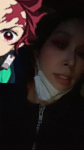 Dark Jacket and Face Mask: A Mysterious Gesture Display