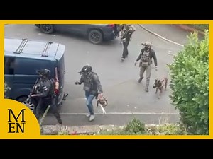 Armed police with chainsaw storm Manchester terror suspects home