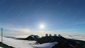 Time lapse of moon setting over Mauna Kea Observatories in Hawaii Island, USA