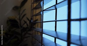 Blinds in the apartment. Inside view. Peeking through the window.