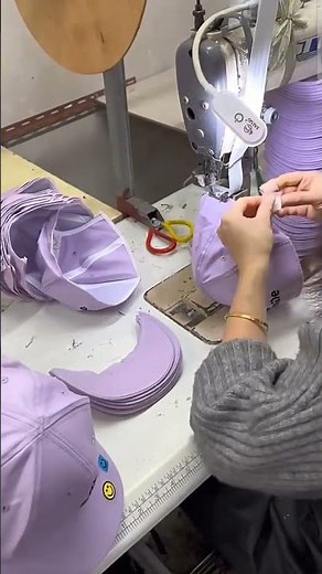 Sewing process of batch brim and sweat band. baseball cap