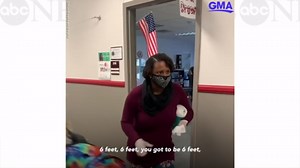 Teacher uses catchy song to encourage social distancing in the hallway