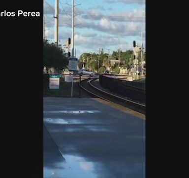 Train hits car sitting partially on tracks