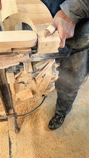 Circular saw cutting wood with steady guiding hands