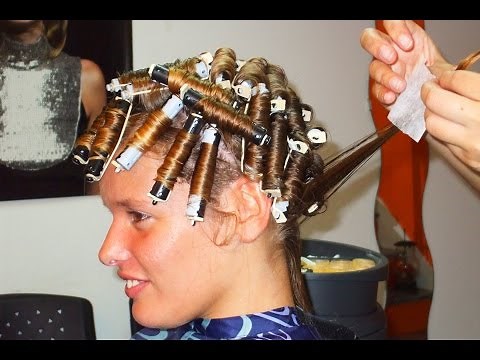 Nice woman with natural straight hair getting a soft roller perm