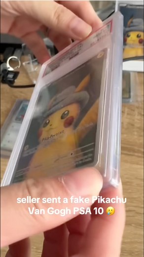 🎨 “The Fake Pikachu Van Gogh Scandal ⚡💸” In a dimly lit room filled with slabs and sleeves, a self-proclaimed “Pokémon investor” smiled at his phone. He’d just sold a Pikachu Van Gogh promo card graded PSA 10—the crown jewel of his collection. Or so the buyer thought. The buyer, an excited collector from across the country, had been saving for months. When the package arrived, he held it like treasure. The PSA label gleamed, the Pikachu wore its little hat, and the card was sealed tight. It lo