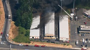 Brush fire spreads to Puyallup storage facility