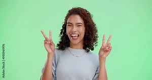 Green screen, hands and face of woman with peace sign, emoji and reaction for message with laugh. Female person, portrait and v symbol for gesture of goodwill, goofy and pout by chromakey with pride