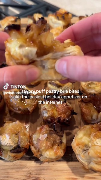 savory puff pastry brie bites with quite literally only five ingredients. they’re close to zero effort but are still DELICIOUS ingredients - puff pastry - sautéed mushrooms - caramelized onions - chopped brie - drizzle of honey #holidayappetizer #puffpastry #easyrecipe #holidayrecipe #creatorsearchinsights