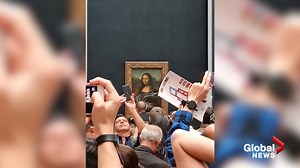 Cake smeared over Mona Lisa in environmental protest