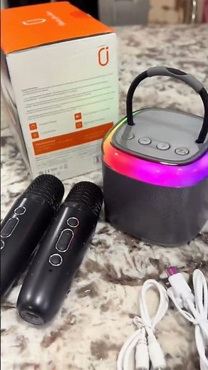 Turn any room into a concert with this Portable Karaoke Machine with Dual Microphones, made for
