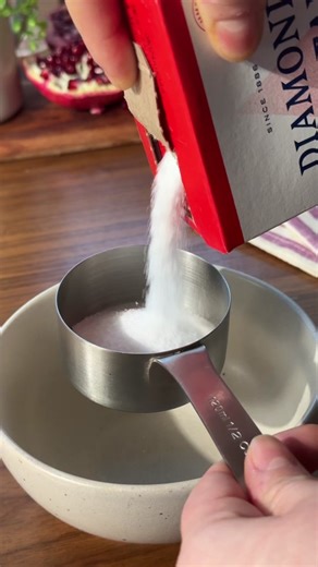 Nothing beats a Christmas cocktail! Grab some Diamond Crystal Kosher salt and stir up this orange pomegranate sparkler! #diamondcrystal #diamondcrystalsalt #holidaydrinks #buynow