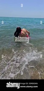 Sensual slow motion hair flip in sea waves Stock Video Footage - Alamy