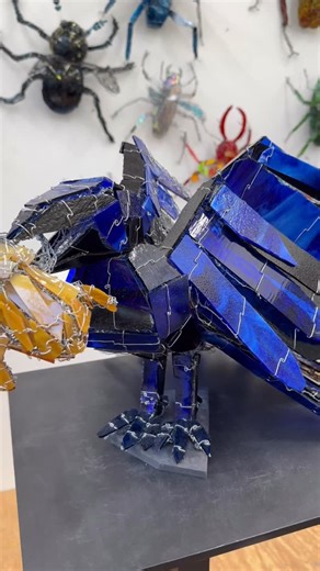 Joan Danziger on Instagram: "It already holds its own in the studio. Under gallery lighting, it will be something else entirely! The full experience begins next Saturday, February 7, when “Ravens: Spirits of the Sky” opens. Join me at the opening reception to see all 22 ravens together in the gallery. Featured work: “Blue Royal Raven with Frog” Glass, wire, and steel 15 x 16 x 22 in #joandanziger #ravensspiritsofthesky #artopening #dcartscene #contemporarysculpture"