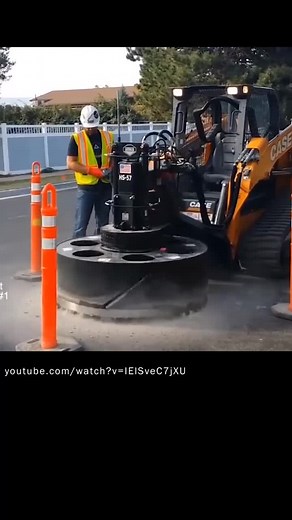 Construction Worker Operates CASE Loader with Safety Gear