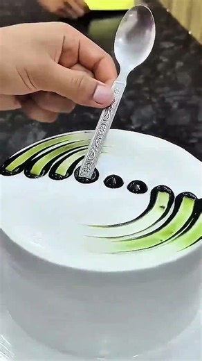 Spoon hovers, icing curves, cake art gleams