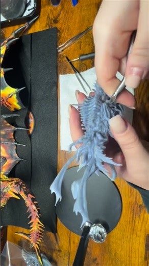 Synn on Instagram: "Sneak peek! 👀 I know I’m really excited about the new dragons but this model has had my eye for a while and is next in queue. Here I’m repairing a misprinted tentacle and removing all tiny print structures left behind from the initial structure removal. This was one printed by my brother-in-law and I’m super excited to start it once my Magma Dragon is done. I’m thinking sea dragon (sea horse type) and nurgle infusion? There’s hands, eyes, mouths and such exposed around the b