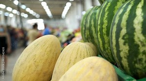 Fresh fruit market. Close up view of fresh-picked watermelons, melon and other food background. Slow motion