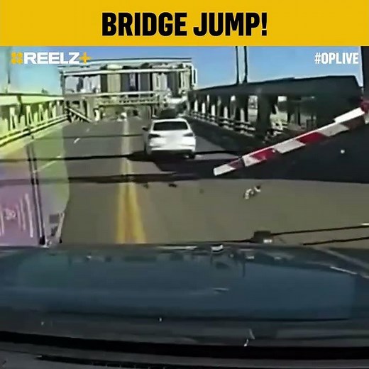 Car Jumps Raised Bridge Like an Action Movie Scene