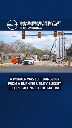 A worker was left dangling from a burning utility bucket before falling to the ground. Investigators believe sparks may have started the fire.