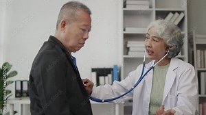 Doctor examining to old man patient by listening lungs and breathing.