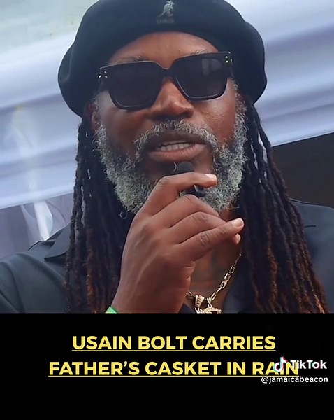 Walking through mud and rain, athletics legend Usian Bolt ensured that his father's final burial rites were not ruined by the elements. The skies opened up as soon as Wellesley Bolt's casket was being removed from the hearse to be brought to the grave inside Reserve Cemetery on Sunday, 4 May 2025. The bereaved wife, Jennifer, gave instruction for the proceedings not to be halted - and she watched it all through the raindrops. 🟠Full story on our YouTube channel. See link in our bio. #jamaicabeac