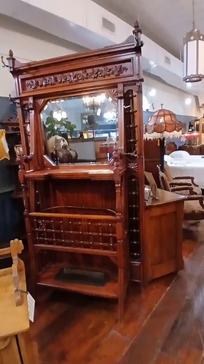 Elevate your entryway with this exquisite Victorian hall tree umbrella stand from the early 19th century, boasting its original cast iron drip pan - a rare find for any antique aficionado! The dimensions are H90" x W45.5" x D17". Listed for $1200, now only $900 firm. For more information call 214-585-2899. | Orchid House Antiques