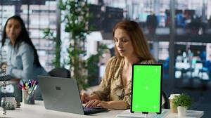 Female CEO engaging in project management using green screen to set goals and objectives, solve problems and track performance metrics of the company. Administrative tasks and decisions. Camera A. Stock Video