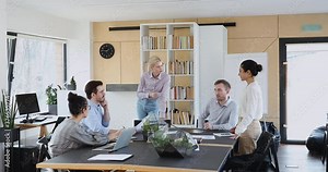 Multiracial ambitious team of professional solving issues new project express opinion share ideas during group meeting in contemporary office. Teamwork, synergy, gender racial equality at work concept