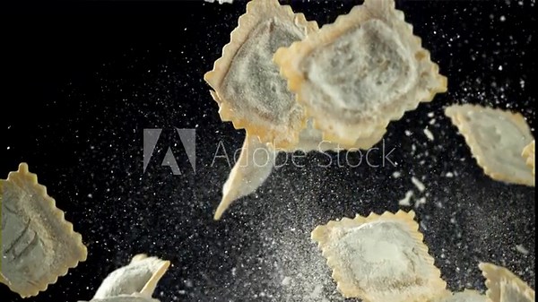 Italian ravioli fly up and fall down with flour. Filmed on a high-speed camera at 1000 fps. High quality FullHD footage